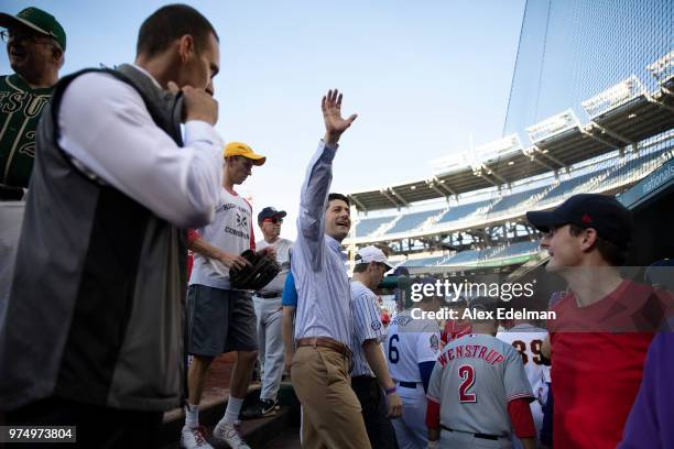 Speaker of the House Rep Paul Ryan waves to fans from the Republican dugout prior to the Congressional Baseball Game on June 14, 2018 in Washington,...