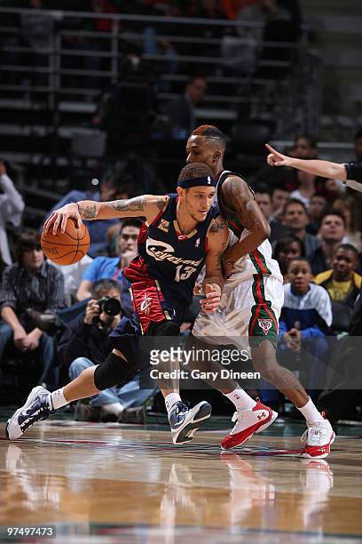 Delonte West of the Cleveland Cavaliers drives to the basket against Brandon Jennings of the Milwaukee Bucks on March 6, 2010 at the Bradley Center...