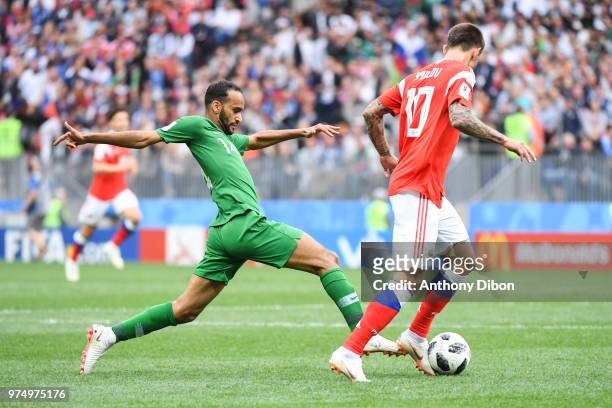 Abdullah Otayf of Saudi Arabia and Fedor Smolov of Russia during the 2018 FIFA World Cup Russia group A match between Russia and Saudi Arabia at...