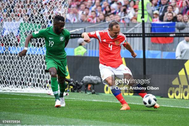 Fahad Almuwallad of Saudi Arabia and Sergey Ignashevich of Russia during the 2018 FIFA World Cup Russia group A match between Russia and Saudi Arabia...