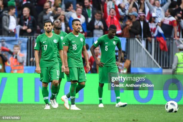 Taiseer Aljasam, Salem Aldawsari and Omar Hawsawi of Saudi Arabia looks dejected during the 2018 FIFA World Cup Russia group A match between Russia...