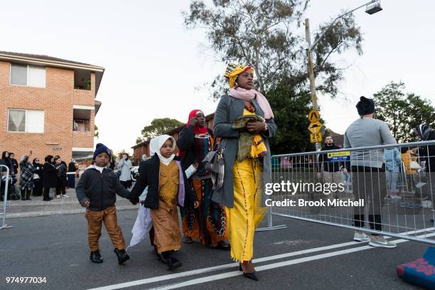 People arrive at Lakemba Mosque on June 15, 2018 in Sydney, Australia. The religious Eid al-Fitr festival is celebrated for three days the end of the...