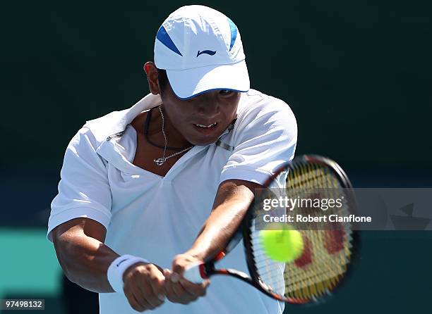 Tsung-Hua Yang of Chinese Taipei plays a backhand duiring his match against Peter Luczak of Australia during day three of the Davis Cup Asia-Oceania...