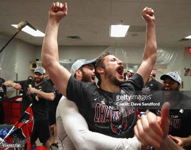 Jay Beagle of the Washington Capitals celebrates after winning the Stanley Cup in the locker room with teammate Devante Smith-Pelly after their 4-3...