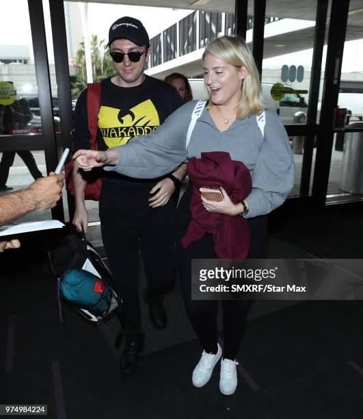 Meghan Trainor and Daryl Sabara are seen at Los Angeles International Airport on June 14, 2018 in Los Angeles, California.