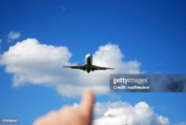 pointing the airplane - touchdown signal stock pictures, royalty-free photos & images