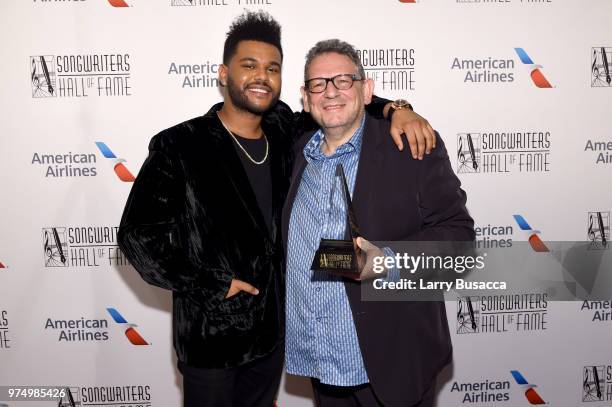 The Weeknd and Howie Richmond Hitmaker Award Honoree Sir Lucian Grainge pose backstage during the Songwriters Hall of Fame 49th Annual Induction and...