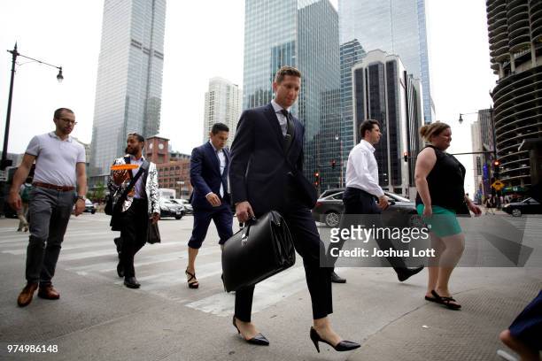 Attorney Jonathan Mraunac walks in women's high heel shoes to raise awareness of sexual assault against women on June 14, 2018 in Chicago, Illinois....