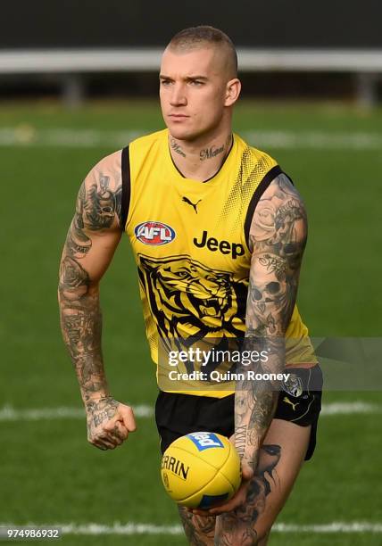 Dustin Martin of the Tigers handballs during a Richmond Tigers AFL training session at Punt Road Oval on June 15, 2018 in Melbourne, Australia.