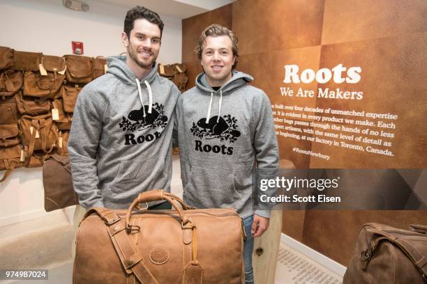 Boston Bruins players Adam McQuaid, left, and Charlie McAvoy in the Roots Legends Leather Heritage Room at the Roots Legends grand opening party on...