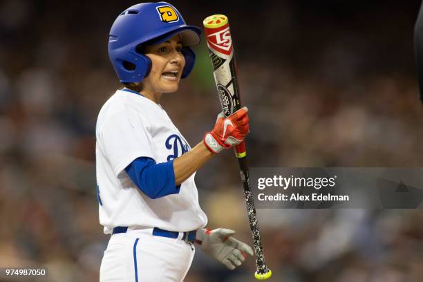 Rep Nanette Barrigen reacts after making contact with the catcher during the Congressional Baseball Game on June 14, 2018 in Washington, DC. This is...