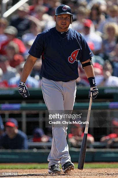 Jhonny Peralta of the Cleveland Indians walks up to the plate against the Cincinnati Reds during a spring training game at Goodyear Ballpark on March...
