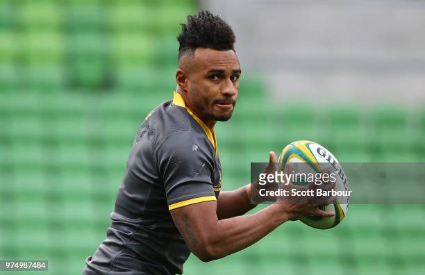 Will Genia of the Wallabies runs with the ball during an Australian Wallabies Captain's Run at AAMI Park on June 15, 2018 in Melbourne, Australia.
