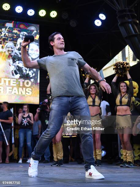 Luca Sbisa of the Vegas Golden Knights throws T-shirts to the crowd as he is introduced at the team's "Stick Salute to Vegas and Our Fans" event at...