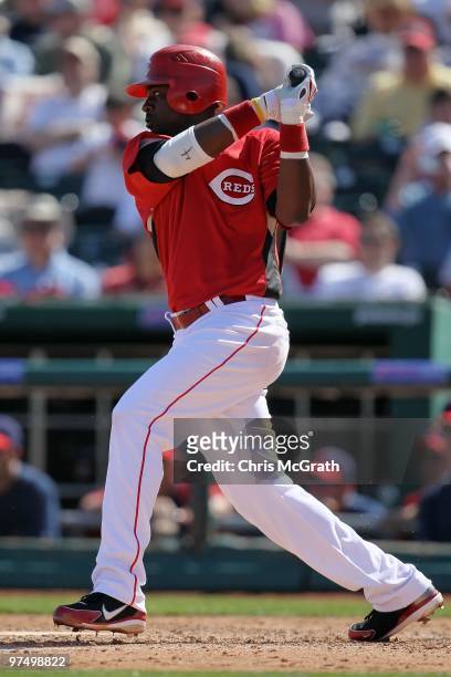 Brandon Phillips of the Cincinnati Reds at bat against the Cleveland Indians during a spring training game at Goodyear Ballpark on March 5, 2010 in...