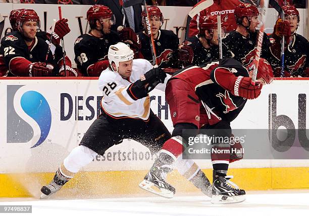 Keith Yandle of the Phoenix Coyotes and Kyle Chipchura of the Anaheim Ducks fight for position on March 6, 2010 at Jobing.com Arena in Glendale,...
