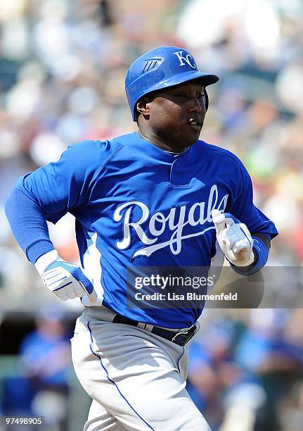 Yuniesky Betancourt of the Kansas City Royals runs to first base during a Spring Training game against the Texas Rangers on March 6, 2010 in...