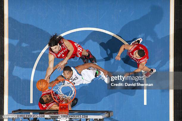 Ryan Gomes of the Minnesota Timberwolves shoots against Jared Jeffreos and Luis Scola of the Houston Rockets during the game on March 6, 2010 at the...