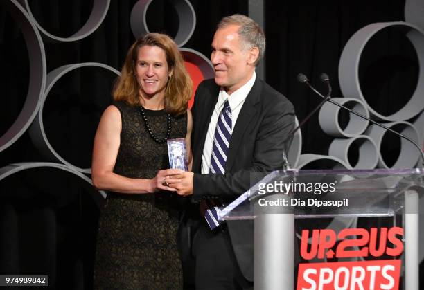 Kathy Carter accepts the Legacy Award from Up2Us Sports Executive Director Paul Caccamo during the 2018 Up2Us Sports Gala celebrates Service Through...