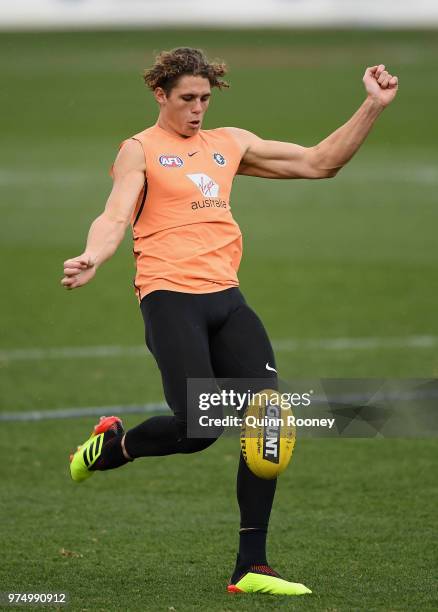 Charlie Curnow of the Blues kicks during a Carlton Blues AFL training session at Ikon Park on June 15, 2018 in Melbourne, Australia.