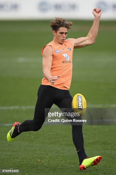 Charlie Curnow of the Blues kicks during a Carlton Blues AFL training session at Ikon Park on June 15, 2018 in Melbourne, Australia.