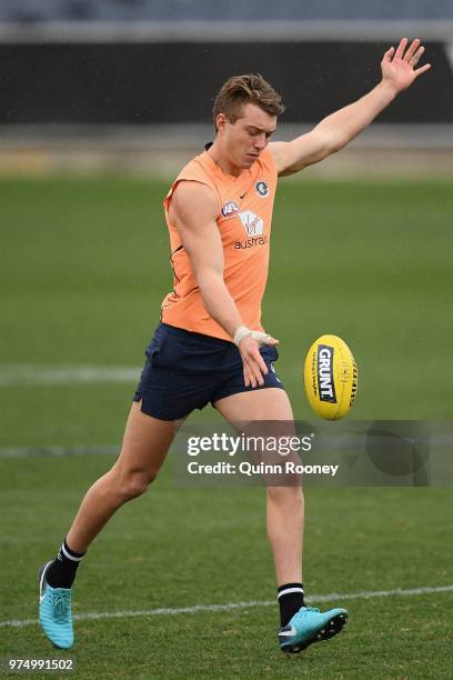 Patrick Cripps of the Blues kicks during a Carlton Blues AFL training session at Ikon Park on June 15, 2018 in Melbourne, Australia.