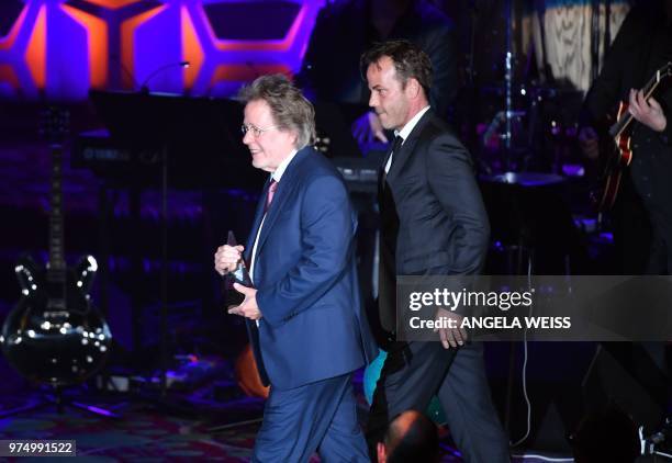 Songwriters Hall of Fame Inductee US songwriter Steve Dorff accepts his award from his son actor Stephen Dorff onstage during the Songwriters Hall of...