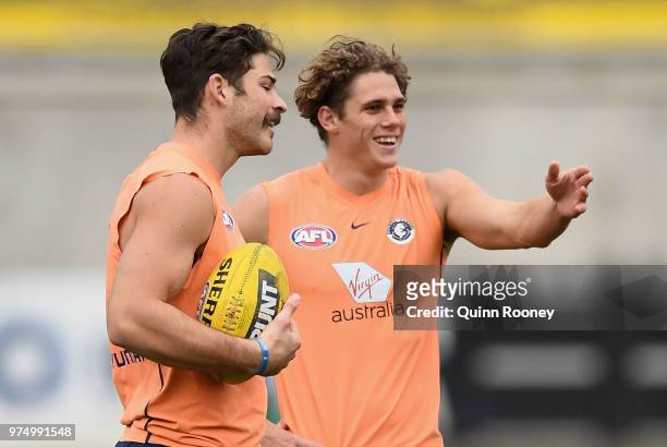 Levi Casboult and Charlie Curnow of the Blues have a laugh during a Carlton Blues AFL training session at Ikon Park on June 15, 2018 in Melbourne,...