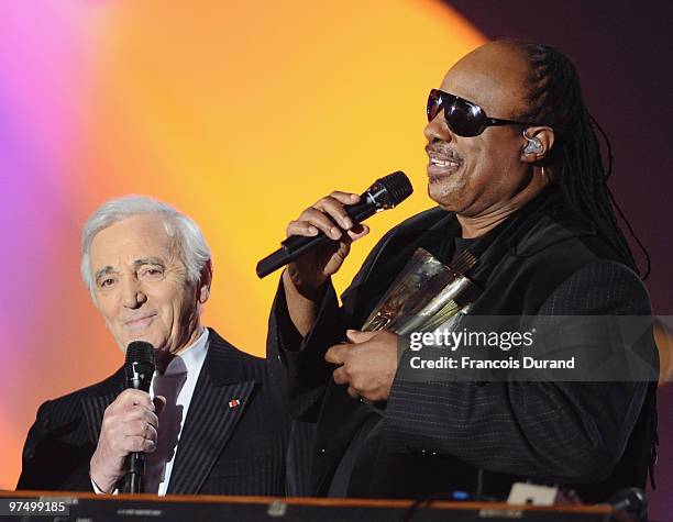 Singer Stevie Wonder receives an award of honor for his career from from singer Charles Aznavour during the 25th Victoires de la Musique yearly...