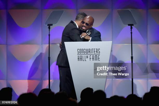 Songwriters Hall of Fame Inductee Jermaine Dupri accepts an award from Chad Elliott onstage during the Songwriters Hall of Fame 49th Annual Induction...