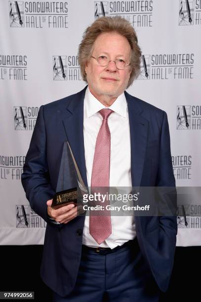 Songwriters Hall of Fame Inductee Steve Dorff poses with his award backstage during the Songwriters Hall of Fame 49th Annual Induction and Awards...