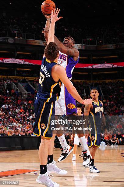 Amare Stoudemire of the Phoenix Suns puts a shot up over Josh McRoberts of the Indiana Pacers in an NBA Game played on March 6, 2010 at U.S. Airways...