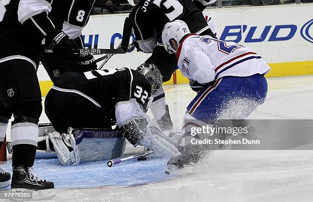 Brian Gionta of the Montreal Canadiens gets a loose puck away from goaltender Jonathan Quick of the Los Angeles Kings and scores a goal 22 seconds...