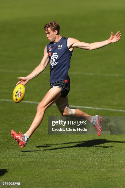 Tom Lynch kicks during a Gold Coast Suns AFL training session at Metricon Stadium on June 15, 2018 in Gold Coast, Australia.