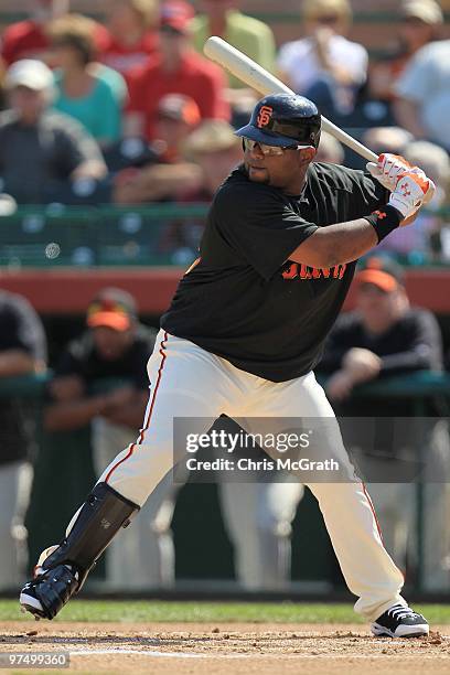Pablo Sandoval of the San Francisco Giants bats against the Milwaukee Brewers during a spring training game at Scottsdale Stadium on March 4, 2010 in...
