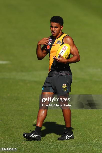 Touk Miller looks on during a Gold Coast Suns AFL training session at Metricon Stadium on June 15, 2018 in Gold Coast, Australia.