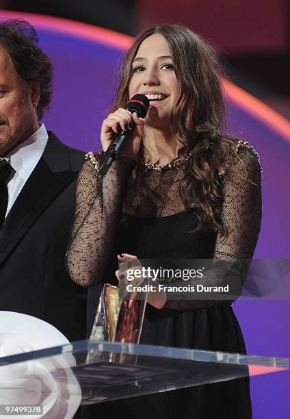 French singer Izia receives an award during the 25th Victoires de la Musique yearly French music awards ceremony at Zenith de Paris on March 6, 2010...