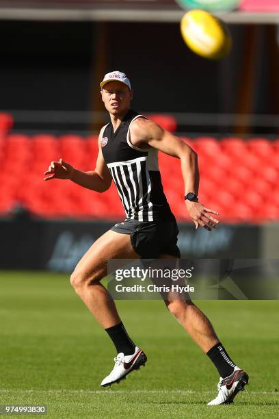 Peter Wright runs for the ball during a Gold Coast Suns AFL training session at Metricon Stadium on June 15, 2018 in Gold Coast, Australia.