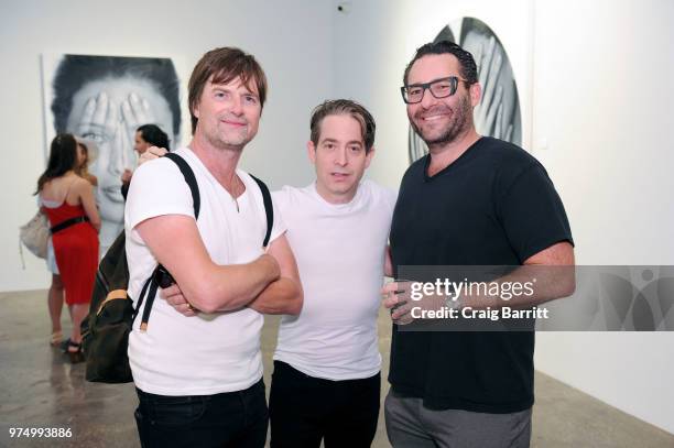 Guests attend the Tigran Tsitoghdzyan "Uncanny" show at Allouche Gallery on June 14, 2018 in New York City.