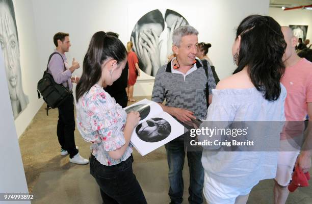 Guests attend the Tigran Tsitoghdzyan "Uncanny" show at Allouche Gallery on June 14, 2018 in New York City.