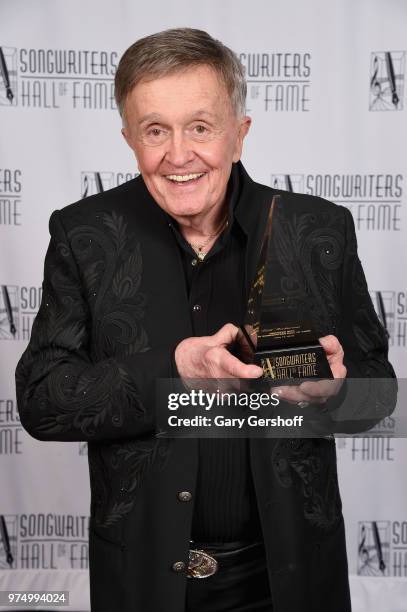 Songwriters Hall of Fame Inductee Bill Anderson poses with an award backstage during the Songwriters Hall of Fame 49th Annual Induction and Awards...