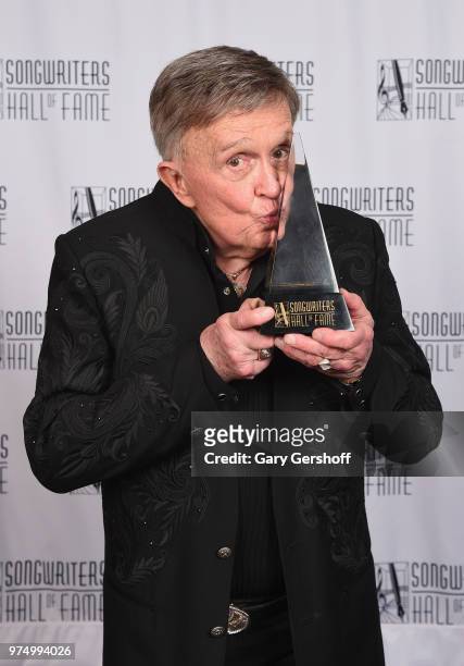 Songwriters Hall of Fame Inductee Bill Anderson poses with an award backstage during the Songwriters Hall of Fame 49th Annual Induction and Awards...