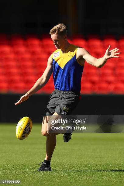 Max Spencer kicks during a Gold Coast Suns AFL training session at Metricon Stadium on June 15, 2018 in Gold Coast, Australia.