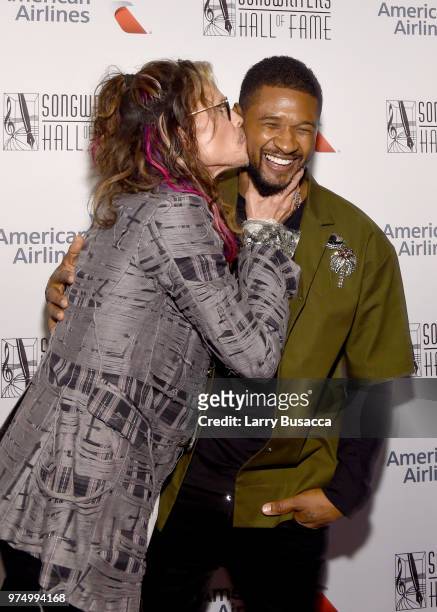 Steven Tyler and Usher pose backstage during the Songwriters Hall of Fame 49th Annual Induction and Awards Dinner at New York Marriott Marquis Hotel...