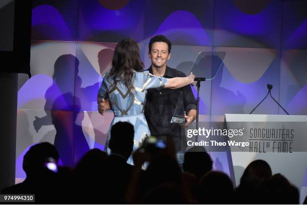 Hal David Starlight Award Honoree Sara Bareilles accepts award from Jason Mraz onstage during the Songwriters Hall of Fame 49th Annual Induction and...
