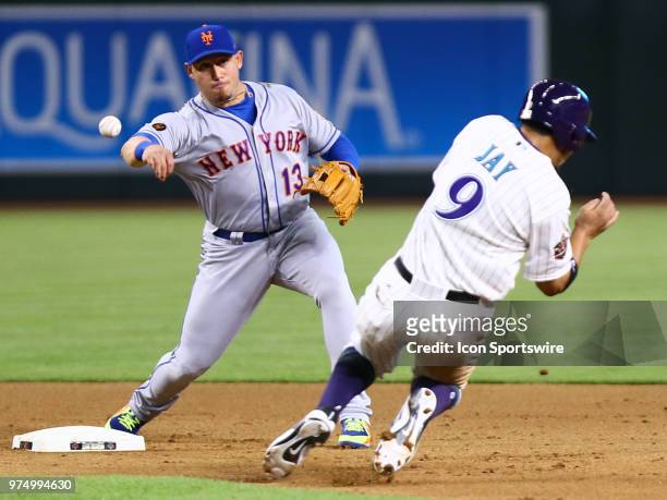 New York Mets second baseman Asdrubal Cabrera turns the double play during the MLB baseball game between the Arizona Diamondbacks and the New York...
