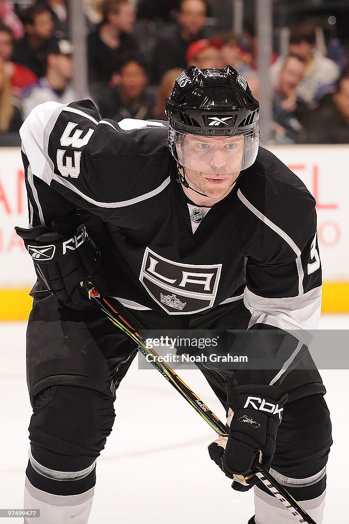 Fredrik Modin of the Los Angeles Kings waits on the ice during a face