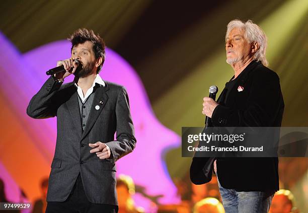 Singers Hugues Aufray and Hugh Coltman perform on stage during the 25th Victoires de la Musique yearly French music awards ceremony at Zenith de...