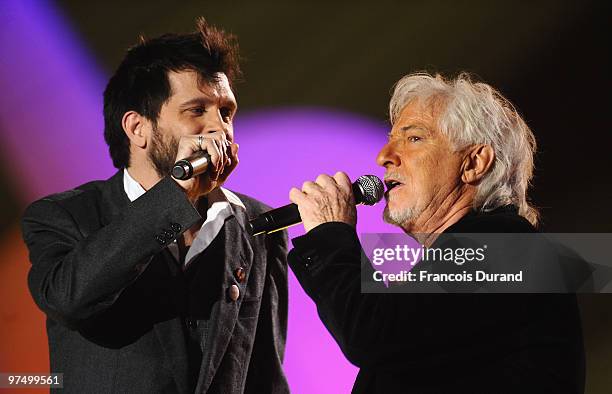 Singers Hugues Aufray and Hugh Coltman perform on stage during the 25th Victoires de la Musique yearly French music awards ceremony at Zenith de...