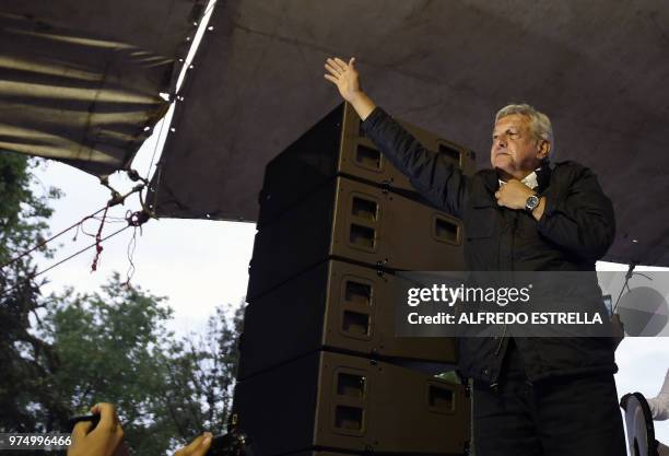 Mexican presidential candidate for the MORENA party, Andres Manuel Lopez Obrador greets supporters, during a campaign rally in Chimalhuacan,State of...